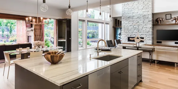 Bright open-concept kitchen with island and pendant lighting